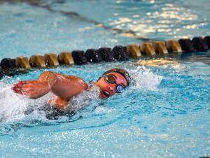 Kayla Helper swimming in a pool.